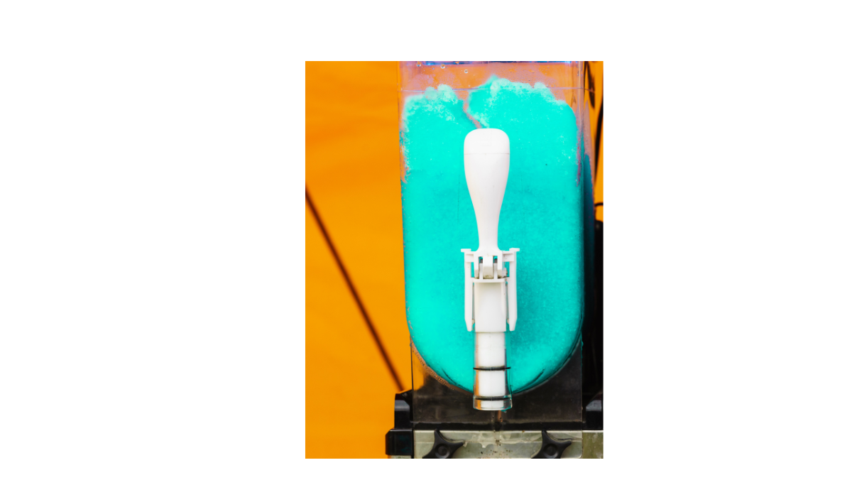 Centered slushie dispenser filled with bright blue frozen slush