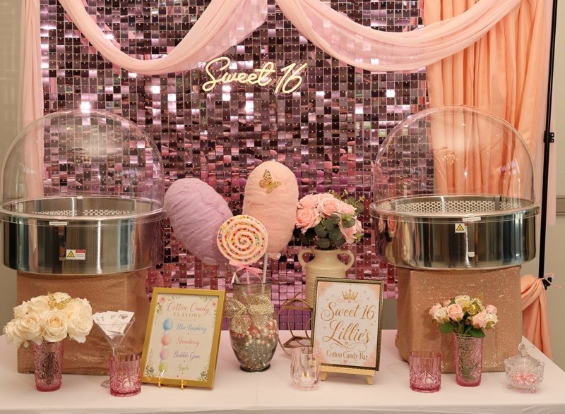 Elegant dual cotton candy machine setup with a pink sequin backdrop