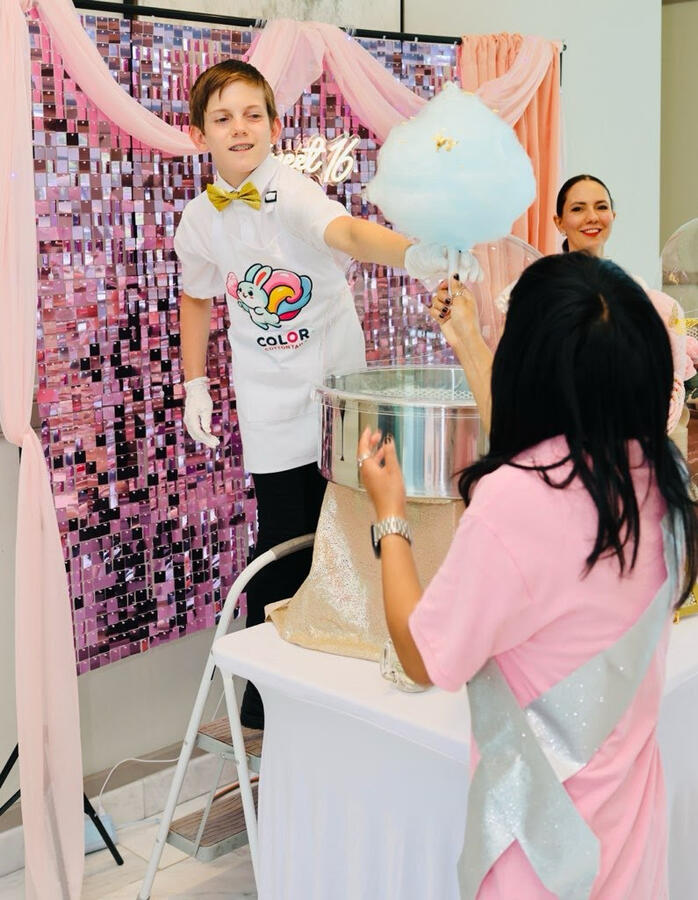 Liam serving cotton candy at a New Hampshire Sweet 16 Liam serving cotton candy at a New Hampshire Sweet 16